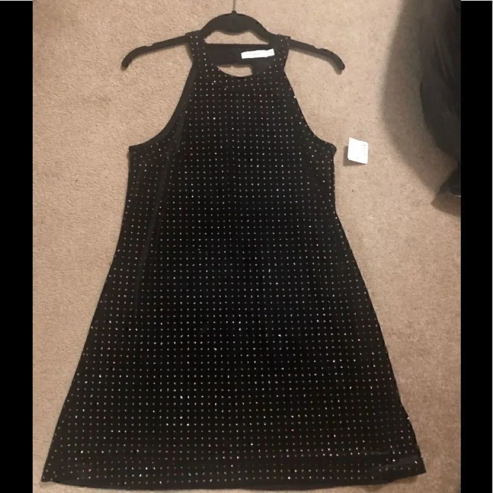47-Little black halter dress with sparkles.